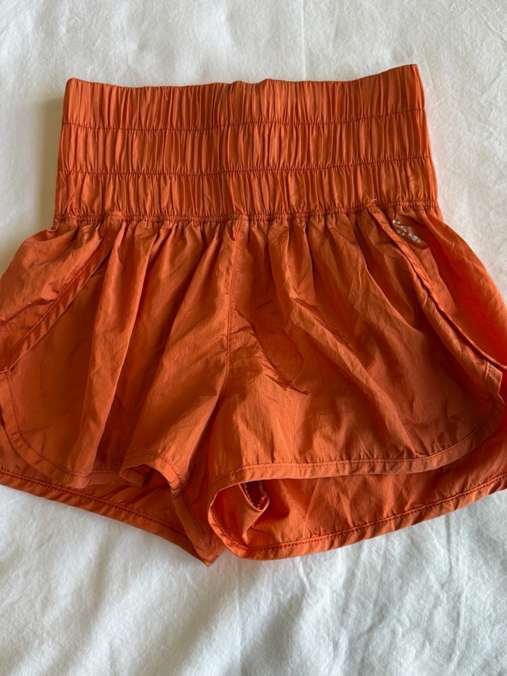 FP Movement by Free People High-Rise Smocked Waist Orange Run Shorts